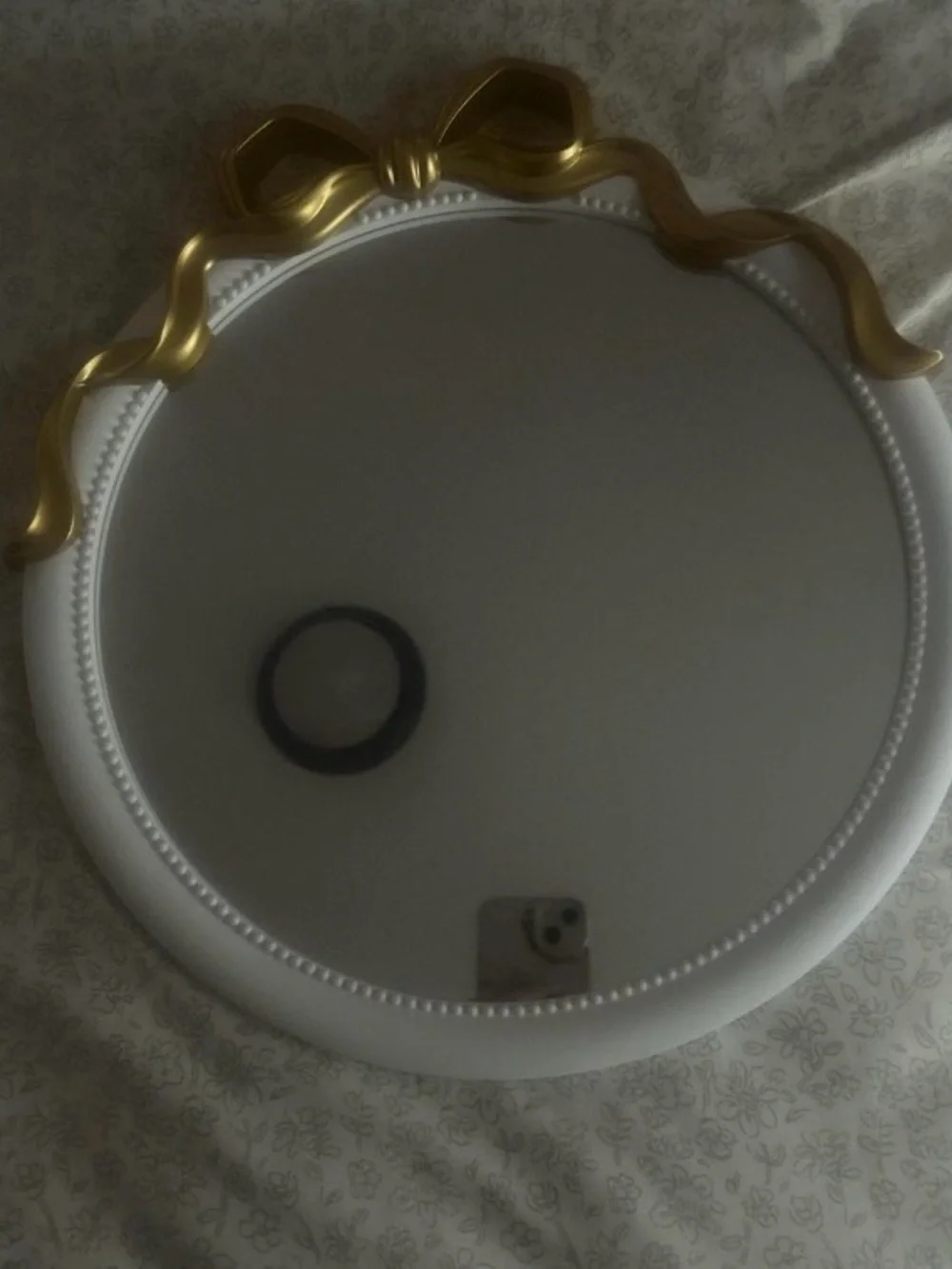 Round Decorative Wall Mirror with Gold Bow Accent
